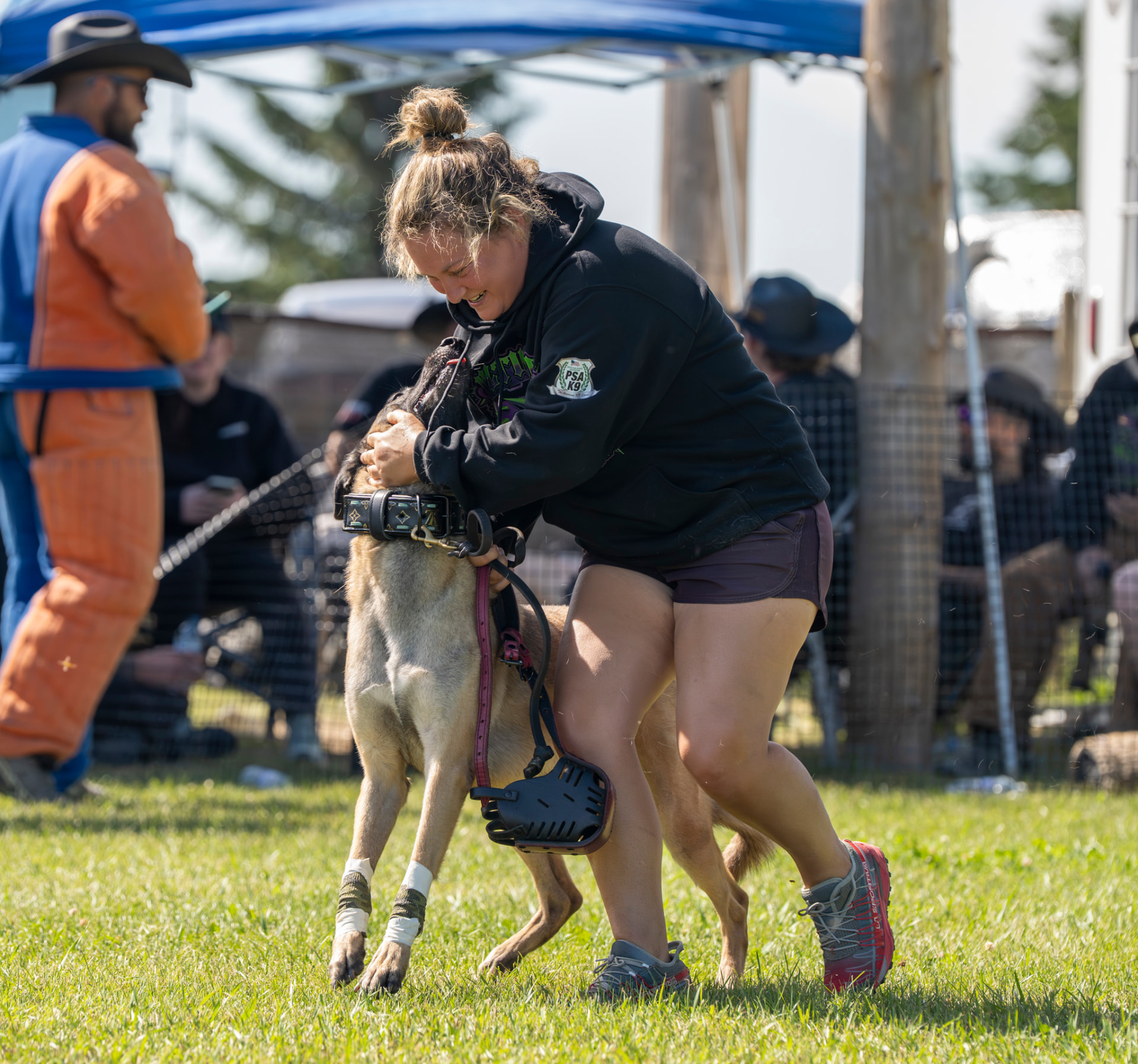 High $takes Media photographer at a dog sports event
